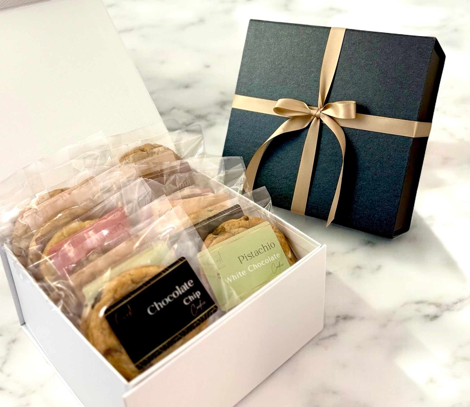 Assorted gourmet cookies featuring a variety of flavors and textures, including classic chocolate chip, pistachio cookie, coffee cookie, hazelnut cookie, macadamia and white chocolate cookie, oats and dark chocolate cookie, walnut milk chocolate cookie, perfect for any sweet craving