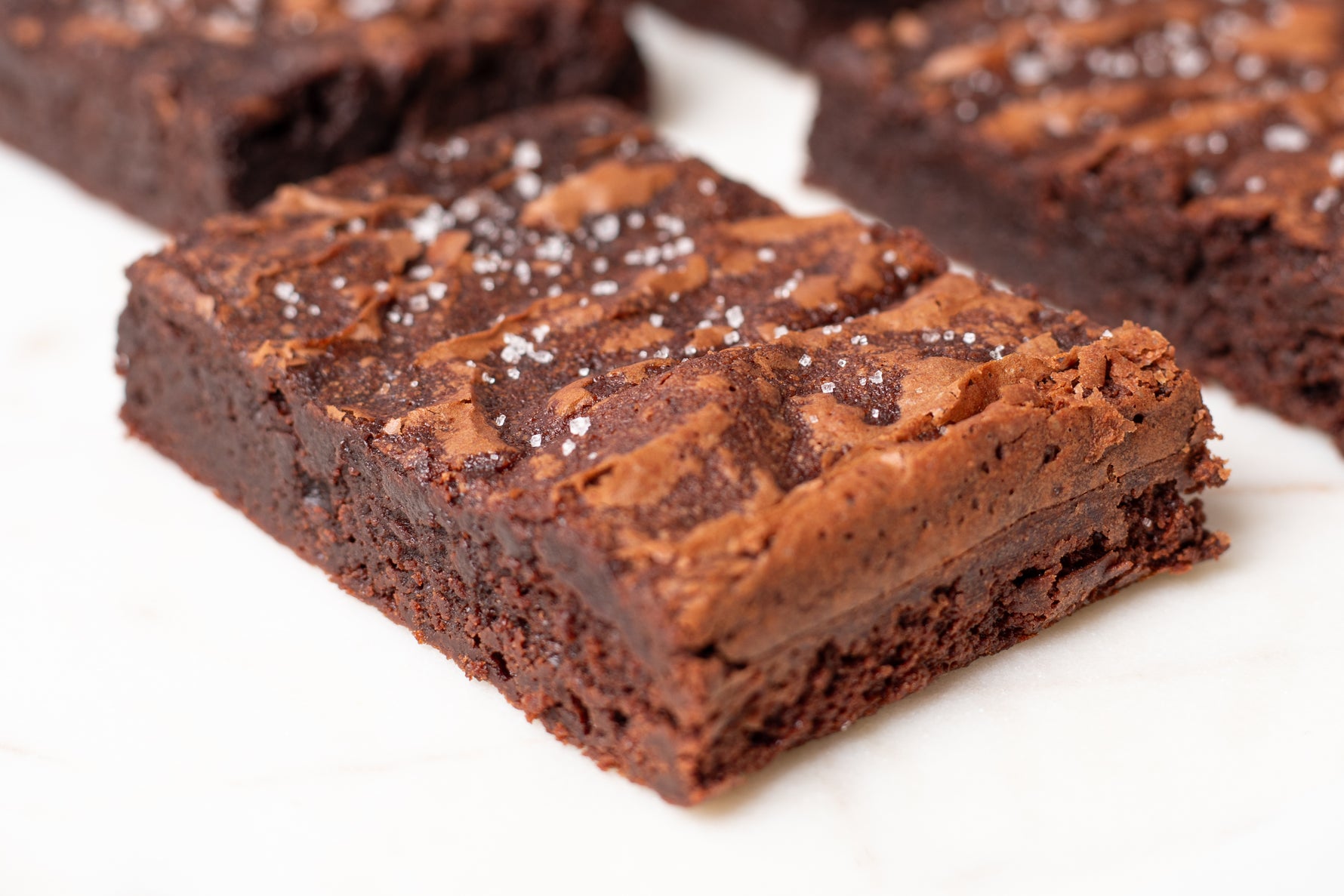 Luxurious fudge brownies finished with a sprinkle of Fleur de Sel from France, enhancing the rich, velvety chocolate with a subtle, savory touch