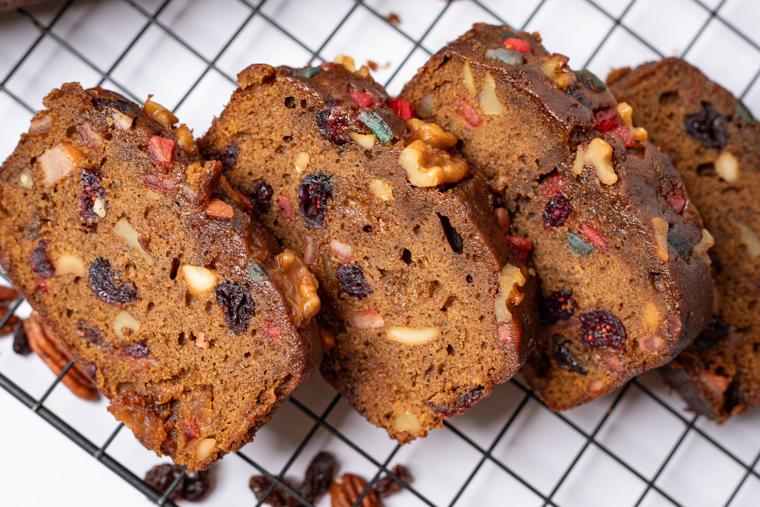 Luxe Fruitcake matured in rum, with caramelized pineapples, cranberries, cherries, raisins, walnuts and pecans.