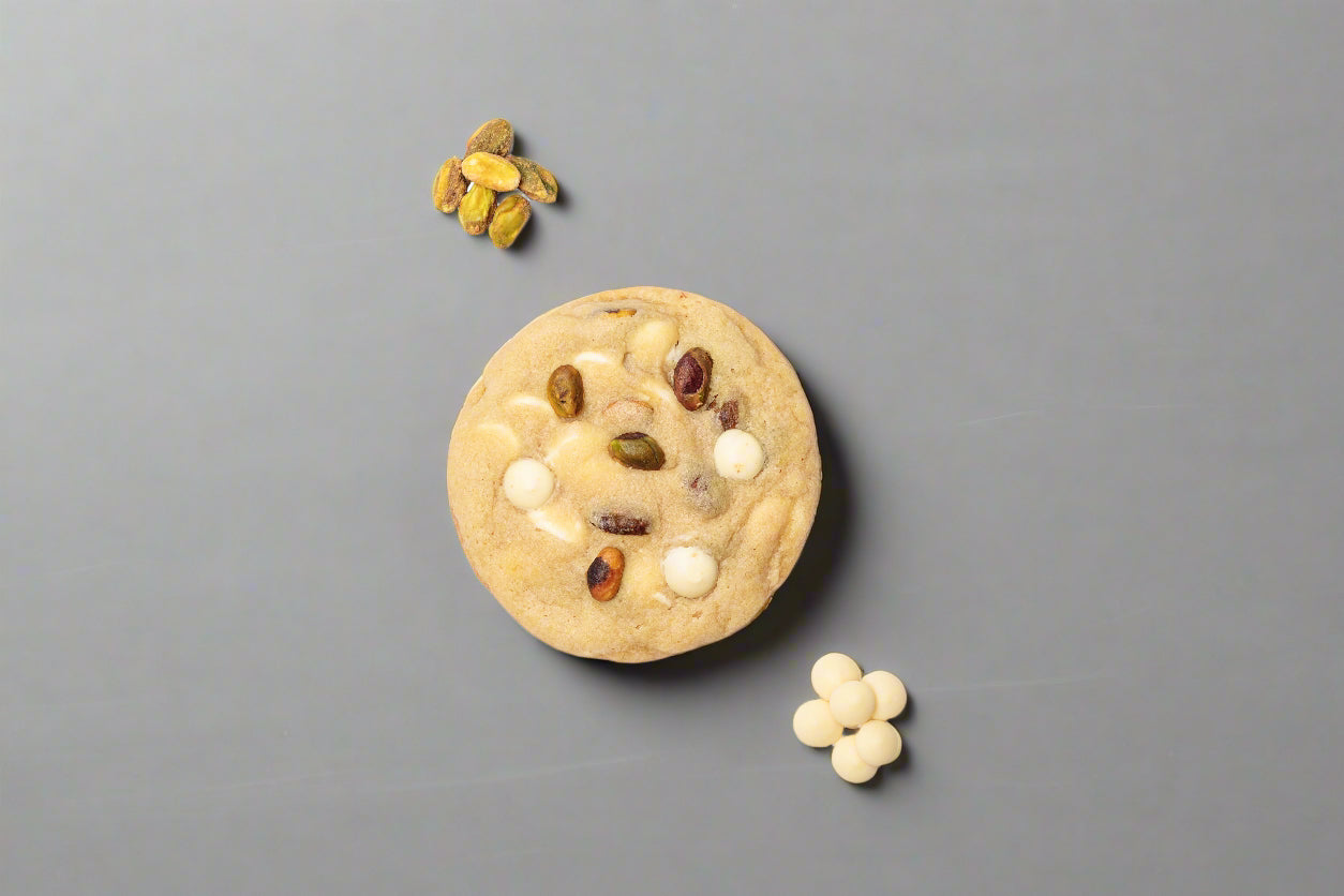 Gourmet pistachio cookies with creamy Belgian white chocolate, combining rich, nutty flavors with smooth, velvety sweetness for an indulgent treat