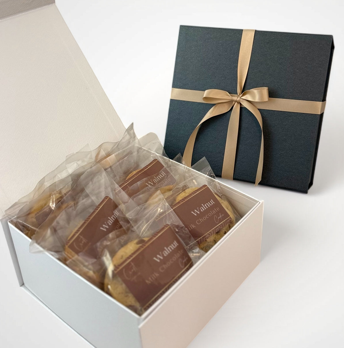 Elegant gift box filled with a dozen delicious walnut cookies and premium Belgian milk chocolate, making the perfect indulgent gift for any occasion