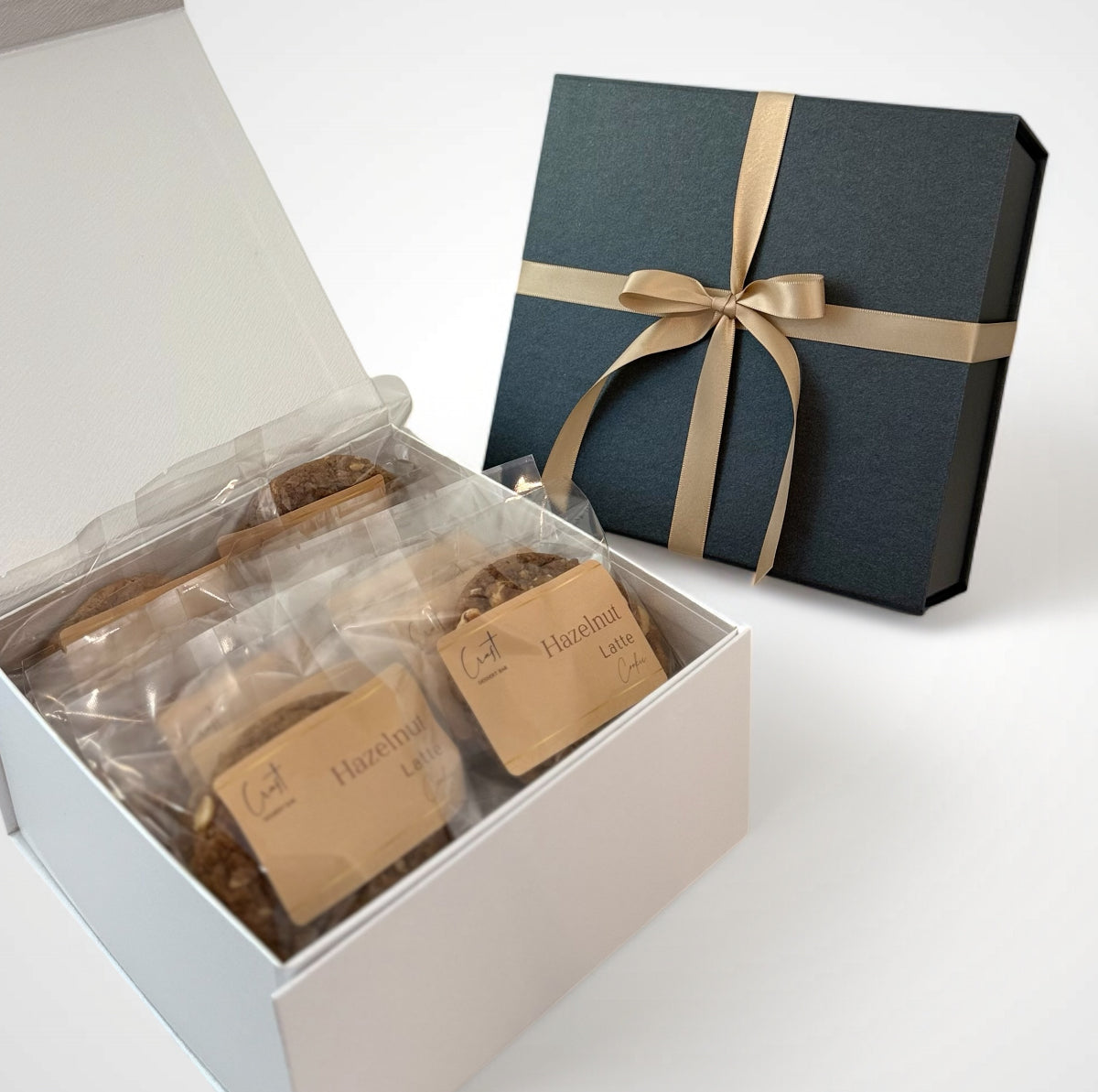 Hazelnut latte cookie in a white and black box with ribbon perfect to give as a gift especially to coffee lovers
