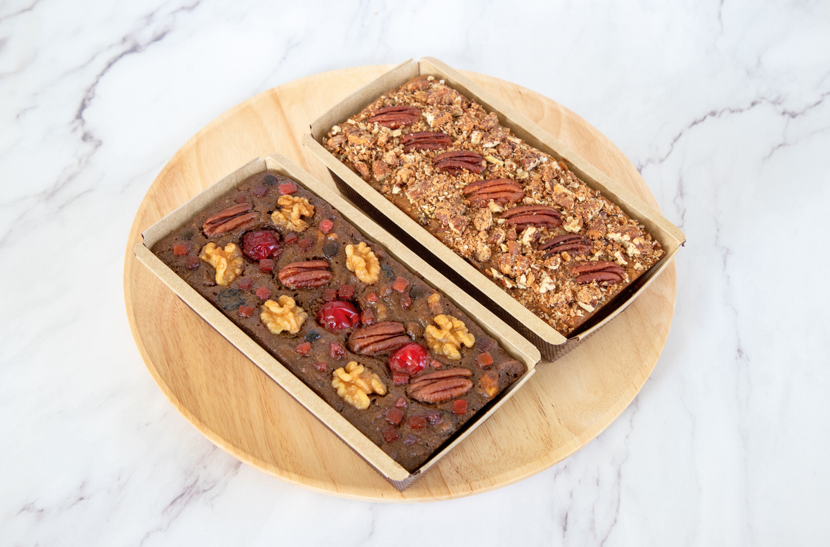 Fruitcake with pecans, walnuts, cranberries, cherries, dates, praline pecans. Rum infused fruitcake. Fruitcake with rum.