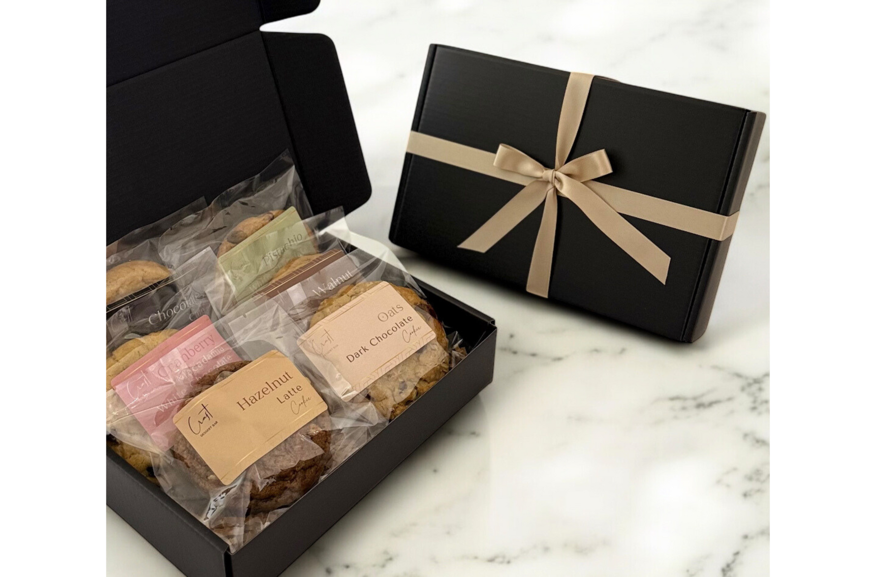 6 pieces assorted cookies in a black box with ribbon
